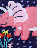 Gepunktetes Kleid mit Dinosaurier-Applikation