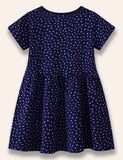 Gepunktetes Kleid mit Dinosaurier-Applikation